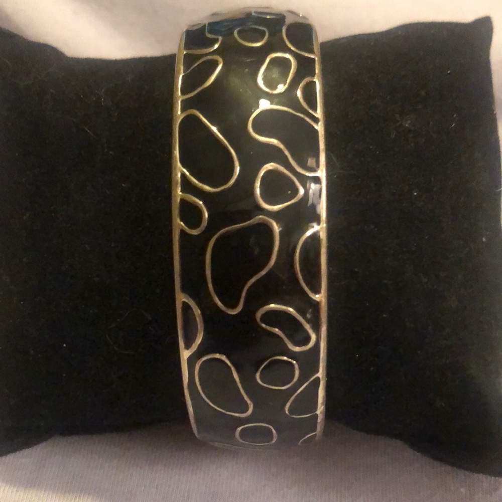 Black enamel and silver tone spring latch bracelet